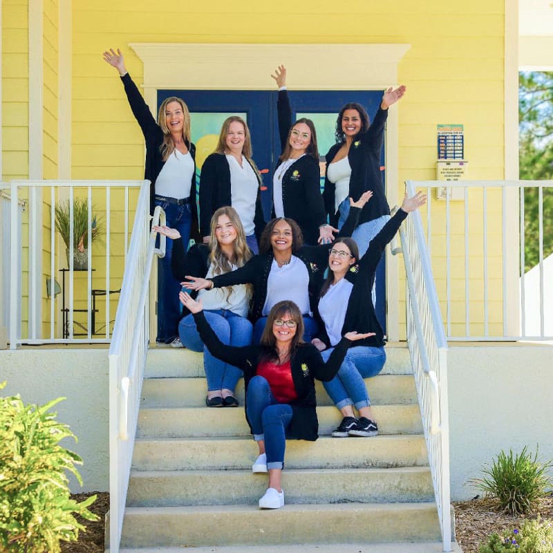 Sunny Smiles team in front of the office