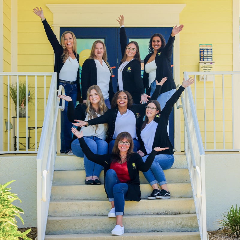 Sunny Smiles team in front of the office